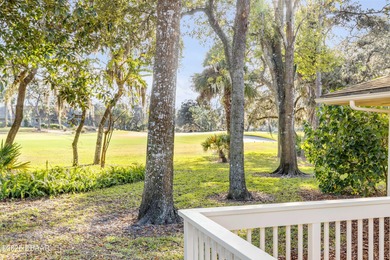 Take in peaceful golf course views from this inviting 2 bedroom on Sugar Mill Country Club in Florida - for sale on GolfHomes.com, golf home, golf lot