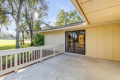 Take in peaceful golf course views from this inviting 2 bedroom on Sugar Mill Country Club in Florida - for sale on GolfHomes.com, golf home, golf lot