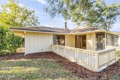 Take in peaceful golf course views from this inviting 2 bedroom on Sugar Mill Country Club in Florida - for sale on GolfHomes.com, golf home, golf lot