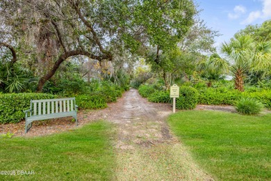 Take in peaceful golf course views from this inviting 2 bedroom on Sugar Mill Country Club in Florida - for sale on GolfHomes.com, golf home, golf lot