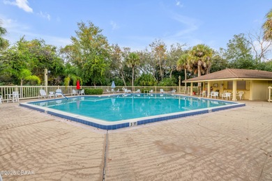 Take in peaceful golf course views from this inviting 2 bedroom on Sugar Mill Country Club in Florida - for sale on GolfHomes.com, golf home, golf lot