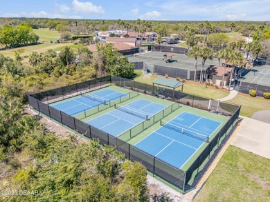 Take in peaceful golf course views from this inviting 2 bedroom on Sugar Mill Country Club in Florida - for sale on GolfHomes.com, golf home, golf lot