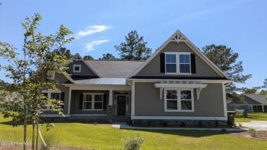 Discover the Skiff, a beautiful new Logan Home, located in on Sea Trail Golf Resort in North Carolina - for sale on GolfHomes.com, golf home, golf lot