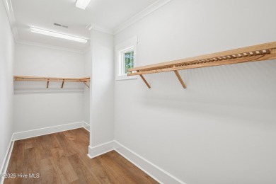 Discover the Skiff, a beautiful new Logan Home, located in on Sea Trail Golf Resort in North Carolina - for sale on GolfHomes.com, golf home, golf lot