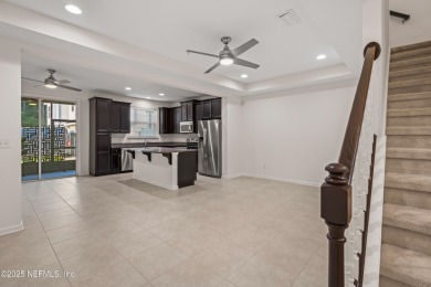 This charming Segovia townhome offers an inviting open floor on Slammer and Squire Golf Course in Florida - for sale on GolfHomes.com, golf home, golf lot