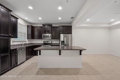 This charming Segovia townhome offers an inviting open floor on Slammer and Squire Golf Course in Florida - for sale on GolfHomes.com, golf home, golf lot