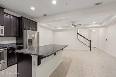 This charming Segovia townhome offers an inviting open floor on Slammer and Squire Golf Course in Florida - for sale on GolfHomes.com, golf home, golf lot