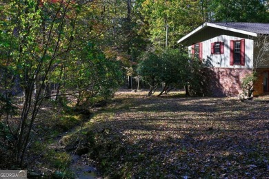 Located on the 17th green of the golf course in the resort-like on Bent Tree Golf Course in Georgia - for sale on GolfHomes.com, golf home, golf lot