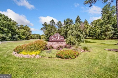 Located on the 17th green of the golf course in the resort-like on Bent Tree Golf Course in Georgia - for sale on GolfHomes.com, golf home, golf lot