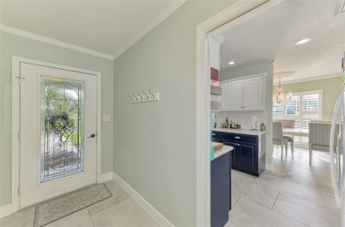 This stunning 3-bedroom, 2-bathroom lakefront home in the highly on Boca Royale Golf and Country Club in Florida - for sale on GolfHomes.com, golf home, golf lot