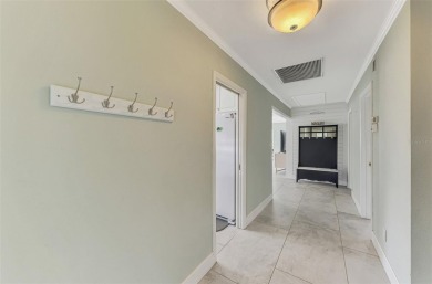 This stunning 3-bedroom, 2-bathroom lakefront home in the highly on Boca Royale Golf and Country Club in Florida - for sale on GolfHomes.com, golf home, golf lot