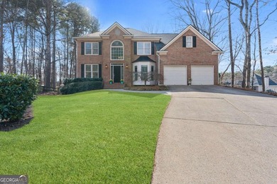 Welcome to this exceptional brick estate in the highly desirable on Towne Lake Hills Golf Club in Georgia - for sale on GolfHomes.com, golf home, golf lot