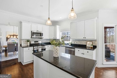 Welcome to this exceptional brick estate in the highly desirable on Towne Lake Hills Golf Club in Georgia - for sale on GolfHomes.com, golf home, golf lot