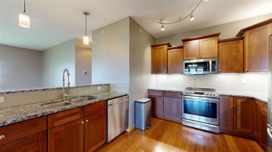 Looking for a top floor condo with priceless views of woods on Blue Top Ridge At Riverside in Iowa - for sale on GolfHomes.com, golf home, golf lot