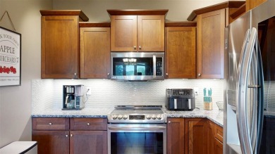Looking for a top floor condo with priceless views of woods on Blue Top Ridge At Riverside in Iowa - for sale on GolfHomes.com, golf home, golf lot