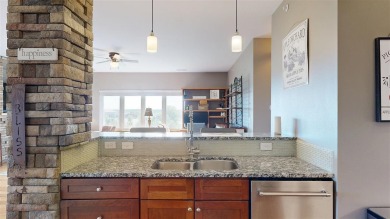 Looking for a top floor condo with priceless views of woods on Blue Top Ridge At Riverside in Iowa - for sale on GolfHomes.com, golf home, golf lot