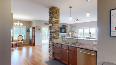 Looking for a top floor condo with priceless views of woods on Blue Top Ridge At Riverside in Iowa - for sale on GolfHomes.com, golf home, golf lot