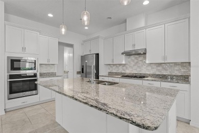 Welcome to this lovely villa nestled in the stunning 55+ on Mystic Dunes Resort and Golf Club in Florida - for sale on GolfHomes.com, golf home, golf lot