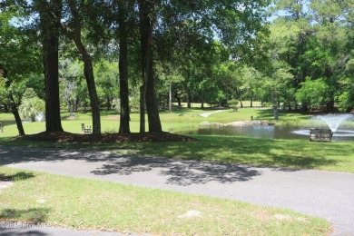 Lovely wooded lot along Fairway #3 in Lockwood Folly Country on Lockwood Folly Country Club in North Carolina - for sale on GolfHomes.com, golf home, golf lot