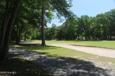 Lovely wooded lot along Fairway #3 in Lockwood Folly Country on Lockwood Folly Country Club in North Carolina - for sale on GolfHomes.com, golf home, golf lot