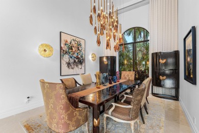 Perched on a rare, oversized lot at the end of a quiet on Boca Delray Golf and Country Club in Florida - for sale on GolfHomes.com, golf home, golf lot