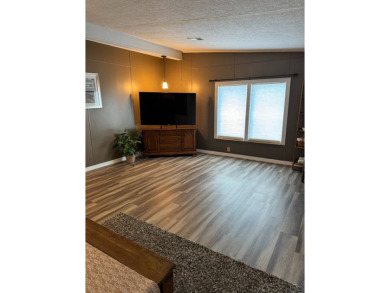 This stunning 2-bedroom, 2-bathroom home, including golf cart on Golden Lakes Golf Course in Florida - for sale on GolfHomes.com, golf home, golf lot