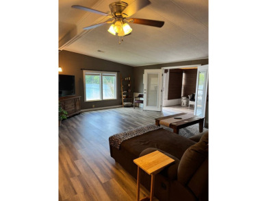 This stunning 2-bedroom, 2-bathroom home, including golf cart on Golden Lakes Golf Course in Florida - for sale on GolfHomes.com, golf home, golf lot