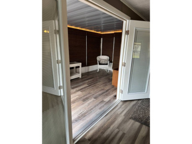 This stunning 2-bedroom, 2-bathroom home, including golf cart on Golden Lakes Golf Course in Florida - for sale on GolfHomes.com, golf home, golf lot