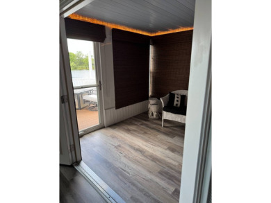 This stunning 2-bedroom, 2-bathroom home, including golf cart on Golden Lakes Golf Course in Florida - for sale on GolfHomes.com, golf home, golf lot