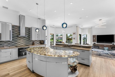 Perched on a rare, oversized lot at the end of a quiet on Boca Delray Golf and Country Club in Florida - for sale on GolfHomes.com, golf home, golf lot