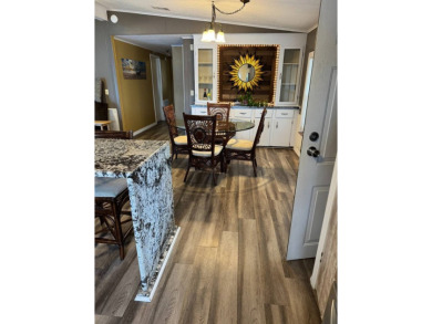 This stunning 2-bedroom, 2-bathroom home, including golf cart on Golden Lakes Golf Course in Florida - for sale on GolfHomes.com, golf home, golf lot