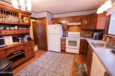 Enjoy easy living in this spacious and bright ranch home in the on The Hideout Golf in Pennsylvania - for sale on GolfHomes.com, golf home, golf lot