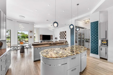 Perched on a rare, oversized lot at the end of a quiet on Boca Delray Golf and Country Club in Florida - for sale on GolfHomes.com, golf home, golf lot