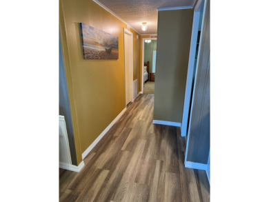 This stunning 2-bedroom, 2-bathroom home, including golf cart on Golden Lakes Golf Course in Florida - for sale on GolfHomes.com, golf home, golf lot