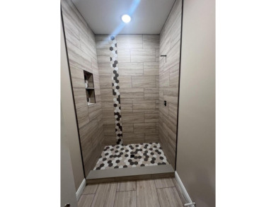 To finish this great condo, we opted to add a fully tiled shower on Juniper Hills Golf Course in Kentucky - for sale on GolfHomes.com, golf home, golf lot