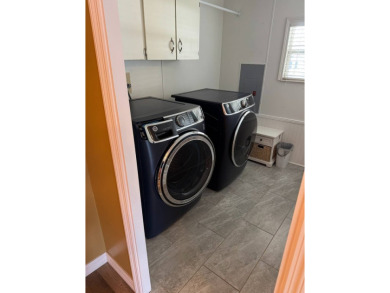 This stunning 2-bedroom, 2-bathroom home, including golf cart on Golden Lakes Golf Course in Florida - for sale on GolfHomes.com, golf home, golf lot