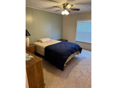 This stunning 2-bedroom, 2-bathroom home, including golf cart on Golden Lakes Golf Course in Florida - for sale on GolfHomes.com, golf home, golf lot