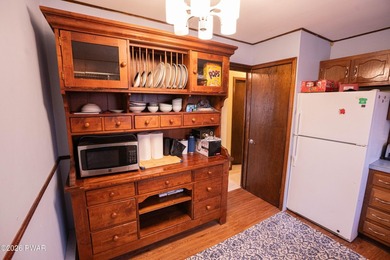 Enjoy easy living in this spacious and bright ranch home in the on The Hideout Golf in Pennsylvania - for sale on GolfHomes.com, golf home, golf lot