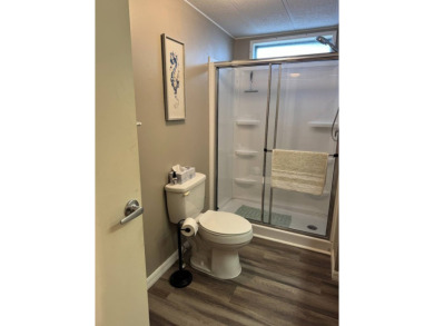 This stunning 2-bedroom, 2-bathroom home, including golf cart on Golden Lakes Golf Course in Florida - for sale on GolfHomes.com, golf home, golf lot