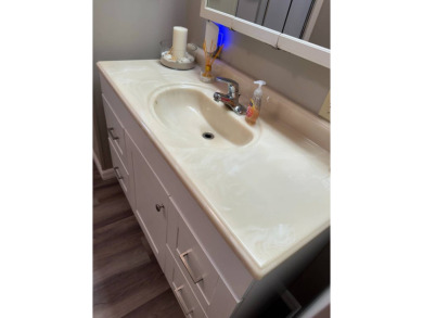 This stunning 2-bedroom, 2-bathroom home, including golf cart on Golden Lakes Golf Course in Florida - for sale on GolfHomes.com, golf home, golf lot