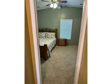 This stunning 2-bedroom, 2-bathroom home, including golf cart on Golden Lakes Golf Course in Florida - for sale on GolfHomes.com, golf home, golf lot