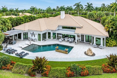 Perched on a rare, oversized lot at the end of a quiet on Boca Delray Golf and Country Club in Florida - for sale on GolfHomes.com, golf home, golf lot