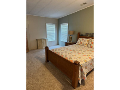 This stunning 2-bedroom, 2-bathroom home, including golf cart on Golden Lakes Golf Course in Florida - for sale on GolfHomes.com, golf home, golf lot