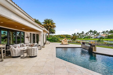 Perched on a rare, oversized lot at the end of a quiet on Boca Delray Golf and Country Club in Florida - for sale on GolfHomes.com, golf home, golf lot