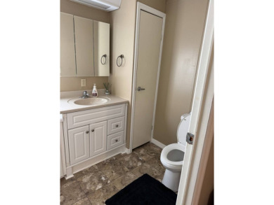 This stunning 2-bedroom, 2-bathroom home, including golf cart on Golden Lakes Golf Course in Florida - for sale on GolfHomes.com, golf home, golf lot