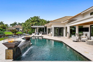 Perched on a rare, oversized lot at the end of a quiet on Boca Delray Golf and Country Club in Florida - for sale on GolfHomes.com, golf home, golf lot