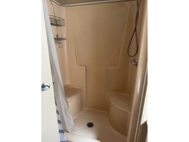 This stunning 2-bedroom, 2-bathroom home, including golf cart on Golden Lakes Golf Course in Florida - for sale on GolfHomes.com, golf home, golf lot