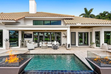 Perched on a rare, oversized lot at the end of a quiet on Boca Delray Golf and Country Club in Florida - for sale on GolfHomes.com, golf home, golf lot