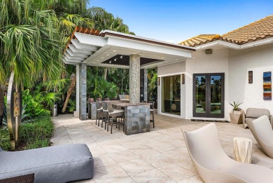 Perched on a rare, oversized lot at the end of a quiet on Boca Delray Golf and Country Club in Florida - for sale on GolfHomes.com, golf home, golf lot