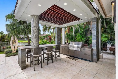 Perched on a rare, oversized lot at the end of a quiet on Boca Delray Golf and Country Club in Florida - for sale on GolfHomes.com, golf home, golf lot